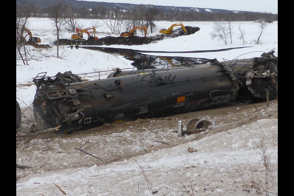 Water, and oil, flows downhill, and a team of excavators worked to stop the oil from flowing to the bottom of the Assiniboine River valley, and the river it contained.