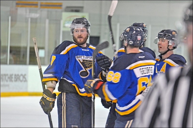 Battleford Beaver Blues players, including defenceman Brandon O’Donnel, gather to congratulate Cody