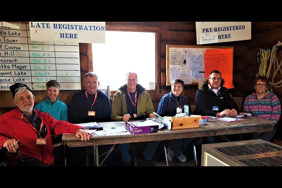 Volunteers manned the registration desk in the hut at the Madge Lake Golf Resort parking lot which was the centre of activity on February 23 when cross-country skiers registered, and later de-registered for the Duck Mountain Loppet. From left, were: Bruno Lemire, organizing committee chair; Barb MacLean, Bob Koroluk, Les Schmidt, Barbara Lange, Kev Sumner and Bobbi Wanner. Pheobe Koroluk was unavailable for the photo.