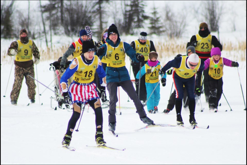 David Richard (with the striped Rocky Balboa shorts), Eli Plamondon and Doug Scott take their first few pulls off the starting line. - PHOTO BY ERIC WESTHAVER