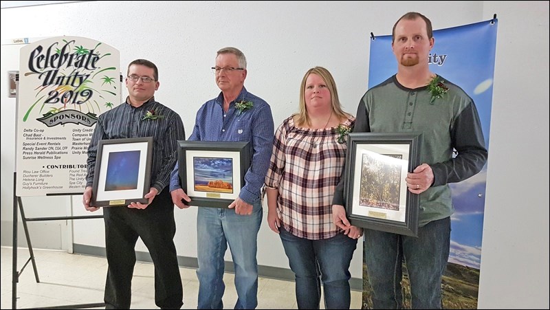 Kylie Uzelman, Ken Leslie and Jennifer and Clint Wilson were all recognized for exemplary service in