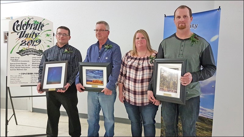 Kylie Uzelman, Ken Leslie and Jennifer and Clint Wilson were all recognized for exemplary service in