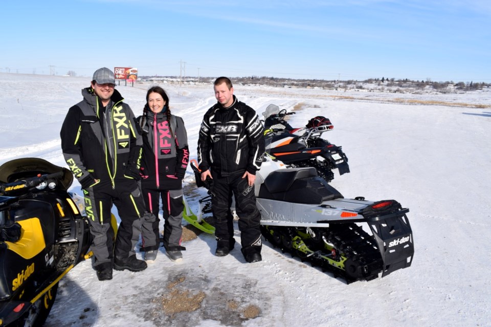 From left, Blair Englot, Julie Biette and Keagan Fieber were among the participants in the Estevan Snowmobile Club’s annual poker derby on Saturday.