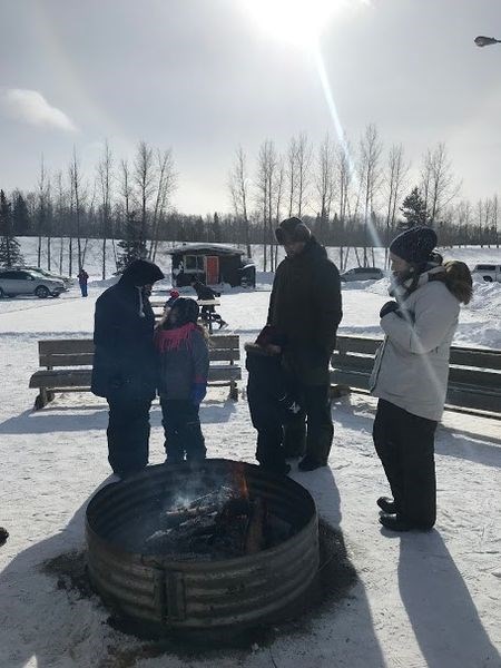 Although the temperatures were in the high minus 20C range, attendees at the Winter Festival held at the Duck Mountain Provincial Park on March 2 were able to find warmth beside the outside fire pit.