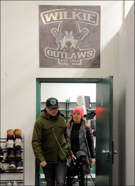 The Sportsnet crew leaving the Outlaws dressing room.