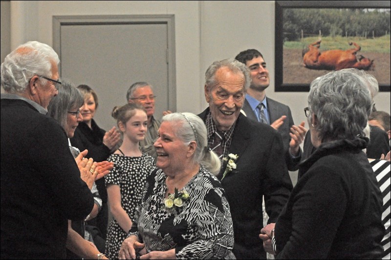 Pius and Ida Pfeifer enter the Citizen of the Year banquet held at the Western Development Museum.