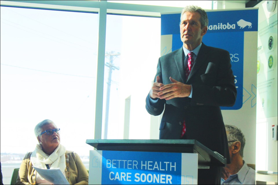 Manitoba Premier Brian Pallister speaks during a press conference at the new Flin Flon General Hospital emergency department while Northern Health Region CEO Helga Bryant looks on March 18. - PHOTO BY ERIC WESTHAVER