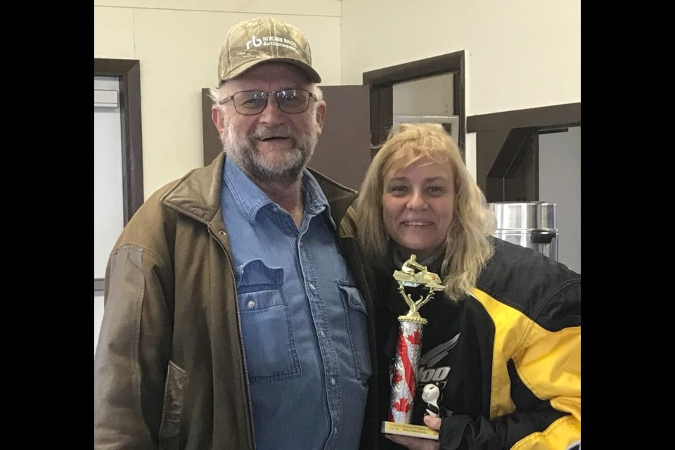 Hal Griffith, Swan Plain Community Centre club vice president, presented Lori Anderson with the Skunk trophy.