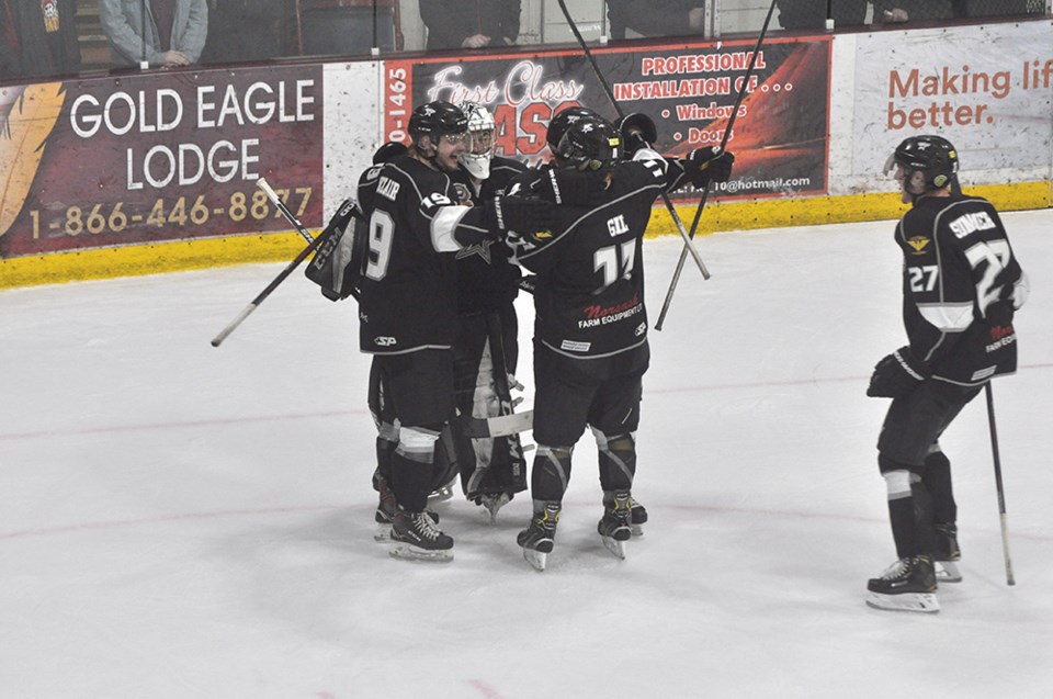 The players mob Joel Grzybowski as the horn sounds in Game 7 of the series.
