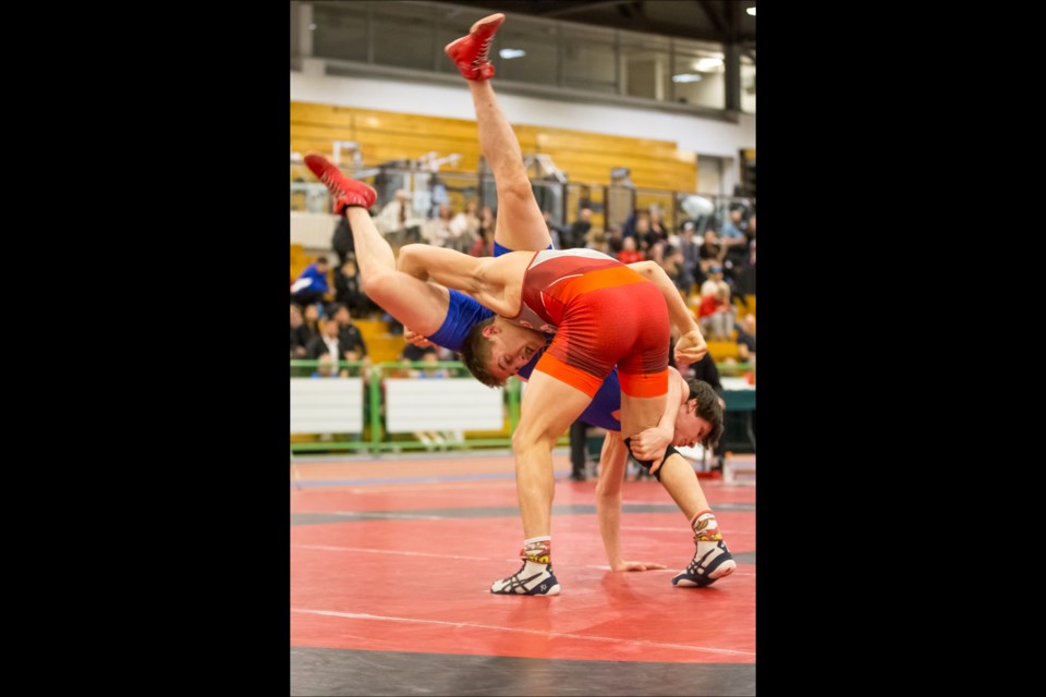 Carson Lee lifts opponent Alexandre Richer during Lee’s win at the Junior Canadian Wrestling Championships in Saskatoon March 23. - PHOTO BY WRESTLING CANADA LUTTE/JOSH SCHAEFER