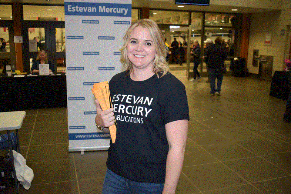 Estevan Mercury Publications sales manager Deanna Tarnes was handing out posters prior to the game.