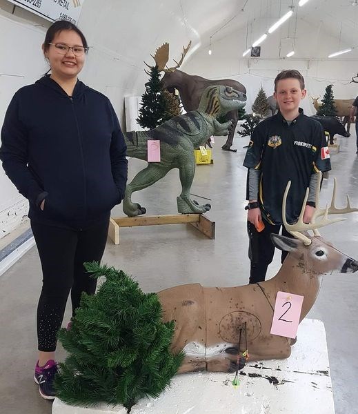 Lilyanna Quewezance and Berkley Prokopetz display their targets at the All Nations 3D Shoot held in Abernathy.