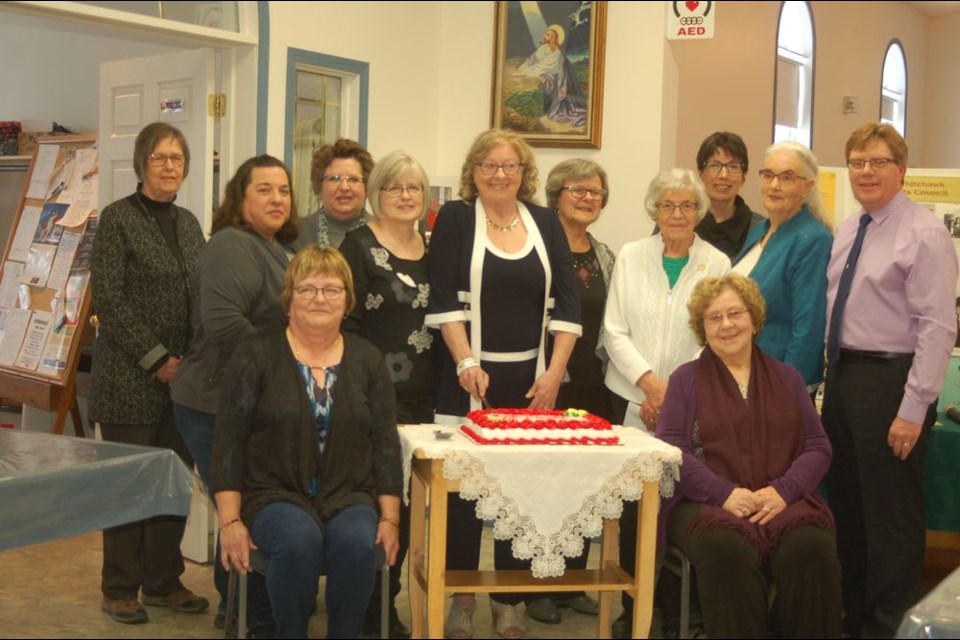 The board members of the Whitehawk Arts Council who helped to cut its 40th year anniversary cake, from left, were: (back row) Barb Wagar, Carla Lewis, Vicky Peet, Barb Melsness, Ivy Krauss, Hazel Urbanoski, Grace Predy, Therese Sandager, Donna Sawchuk and Miles Russell, and, (front) Lois Person and Leona Pollock.