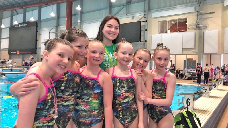 Age 10 and Under Team with their coach, Courtney Roberts, team members include: (not in order) Morgan Vaughn, Emma Briant, Olivia Wiebe, Hanna Hyland, Brynn Hawkins and Hannah Mortiz.