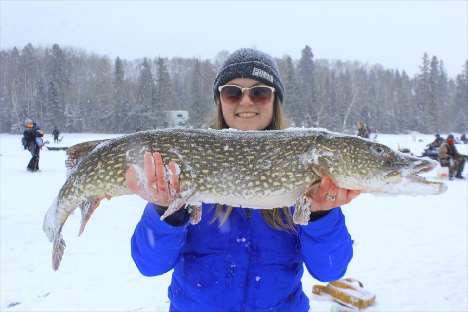 Morganna Senyk shows off her trophy-winning jackfish. Caught within minutes of the derby’s start, Senyk’s 100-centimetre catch was the largest of 31 fish caught on the day. - PHOTO BY ERIC WESTHAVER