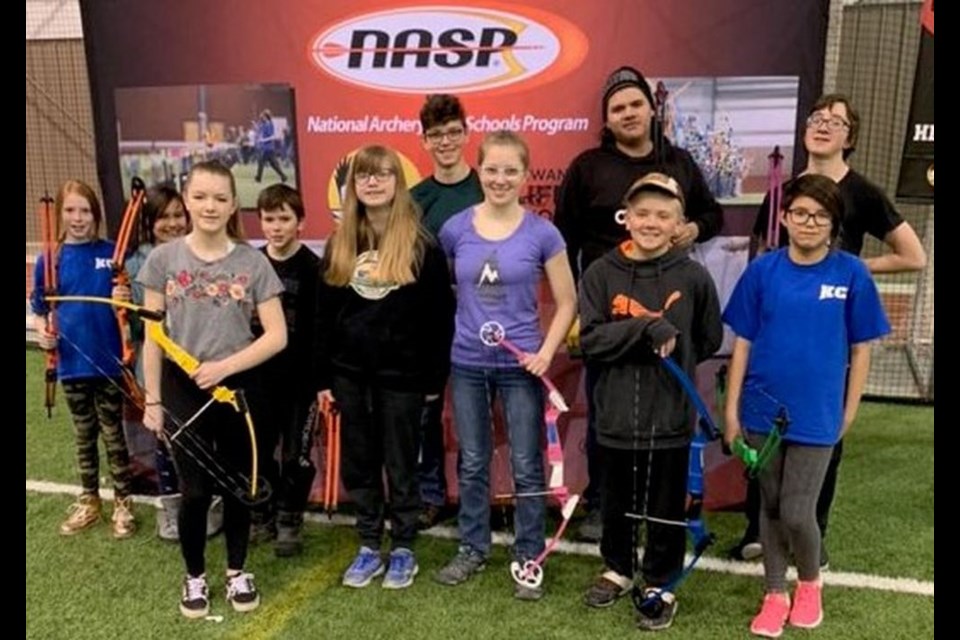 Student archers who participated in the provincial archery shoot, from left, were: (back) Takara Maciborski, Dionysus Shingoose, Blayd Henry-Martino, Kyler Kitsch, Taylen Keshane and Curtis Berezowski, and (front) Maison Davis, Willow Davis, Kira Kitsch, Jacob Burback and Serenity Friday.