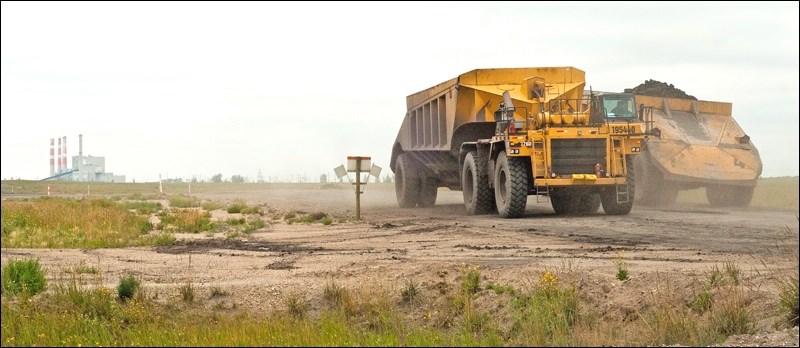 These coal haulers cross Highway 47 south of Estevan. Would you want them to do so without drivers?