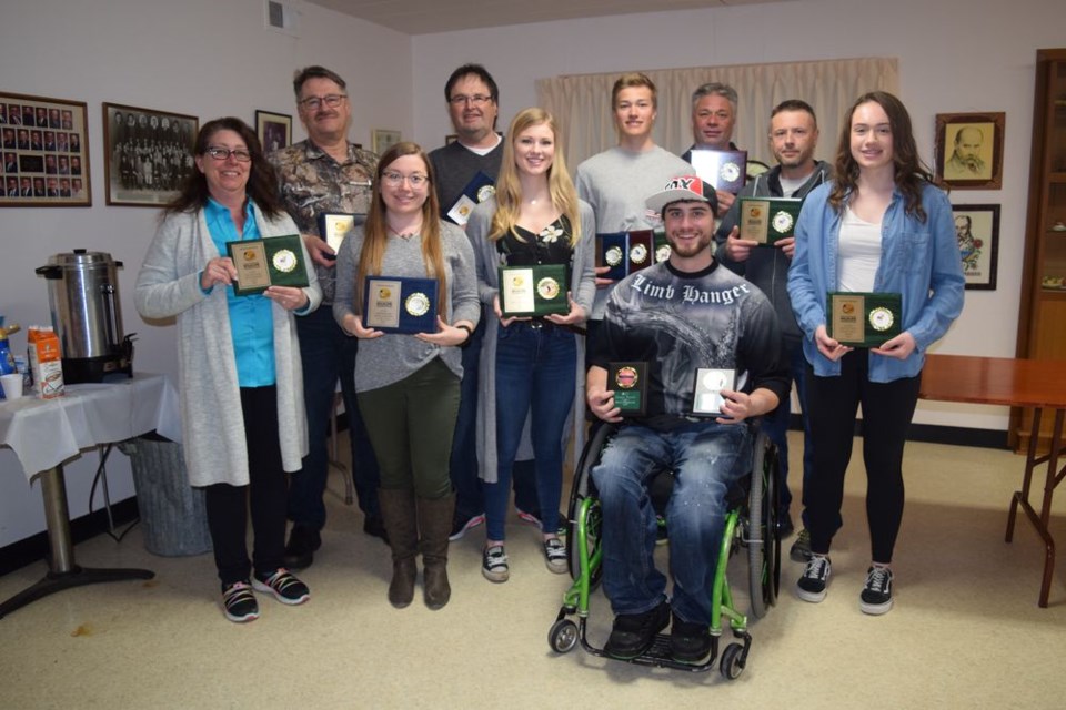 Winners recognized during the awards banquet, from left, were: (back row) Nestor Dutchak (men’s perch), Chester Dutchak (men’s northern pike), Brendan Landstad (junior boys Canada goose, mule deer and northern pike), Greg Landstad (men’s Canada goose), and Wade Tratch (men’s white-tailed deer), and (front) Leslie Hryhoriw (women’s white-tailed deer), Jessica Landstad (women’s northern pike), Kaitlyn Landstad (women’s elk), Josh Gogol (wildlife and scenic photography) and Meadow Ostafie (junior girls white-tailed deer.) Unavailable for the photo were: Donny Chupa (men’s non-typical mule deer), Mike Zbeetneff (men’s non-typical white-tailed deer), Kyle Wyonzek (men’s moose), Cindy Dutchak (women’s walleye) and Hudson Bailey (junior boys white-tailed deer.)