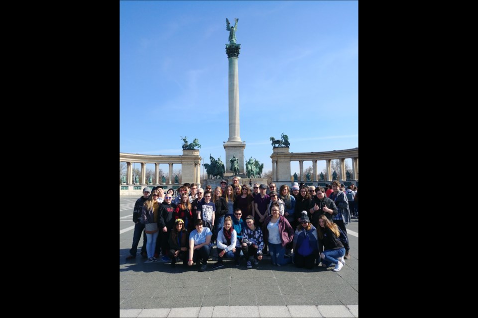 Members of the Hapnot travel club pose for a group photo at Heroes’ Square in Budapest, Hungary. A total of 37 people, consisting of students, chaperones, parents and teachers, took part in this year’s trip. - SUBMITTED PHOTO