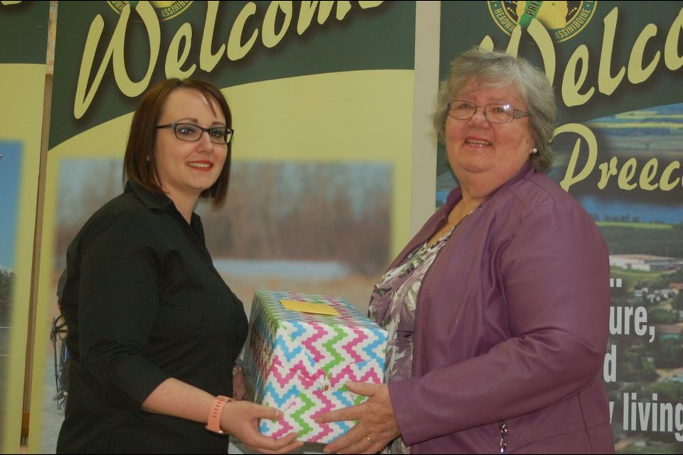 Stacey Strykowski, Town of Preeceville Councillor (left), presented Maureen Johnson with a special gift in acknowledgment of her volunteer dedication.