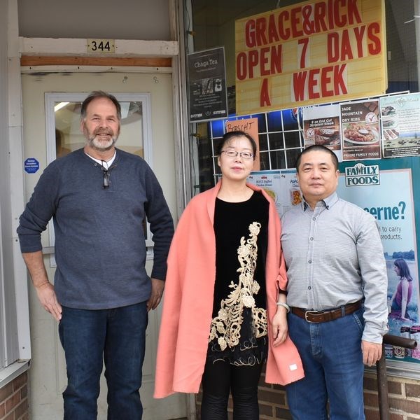 Tom, Grace and Rick outside store