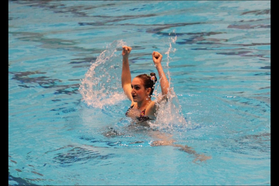 Flin Flon Aqua Doves swimmer Maryn McKee performs a routine. McKee competes in the ages 16 to 18 division and earned two podium finishes at the recent Saskatchewan provincial synchronized swimming championships in Saskatoon. - SUBMITTED PHOTO