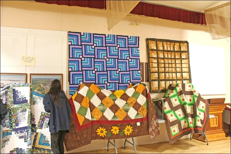 A collection of quilts done by the Rabbit Lake Quilters over the winter. All quilts are a variation of the log cabin pattern.