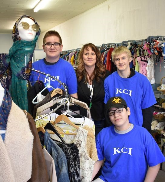Students from KCI (Kamsack Comprehensive Institute) have begun working at Sparty’s Thrift Store on Main Street. From left, were: (back) Kole Ferrill; Lisa Kuba-Hausermann, EA (Educational Assistant), and Raiden Jeffrey and (front, kneeling) McIvor Kitchemonia.