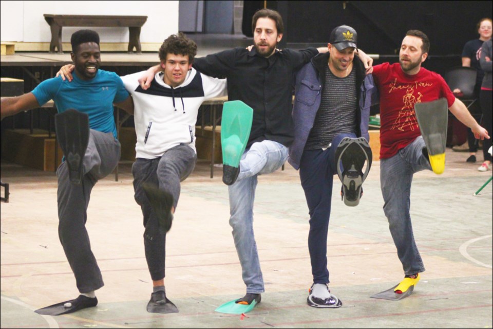 Bubba Adegboye, Mason Tower, Mike Spencer, Zachidiniak and Alain Lachapelle do a kick dance while decked out in flippers. - PHOTO BY ERIC WESTHAVER