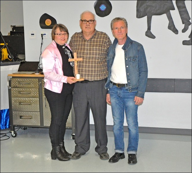 Seen here is the presentation of a Lumen Christi award to Keith Koberinski by Stephanie Merkowski and Glen Gantefoer. Photos by John Cairns