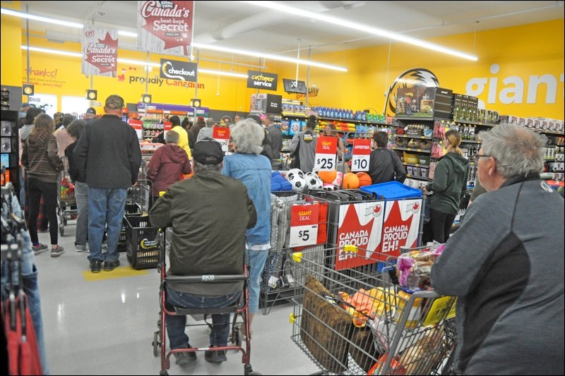 Customers lined up for the opening of the new Giant Tiger location in downtown North Battleford Saturday. Photos by John Cairns