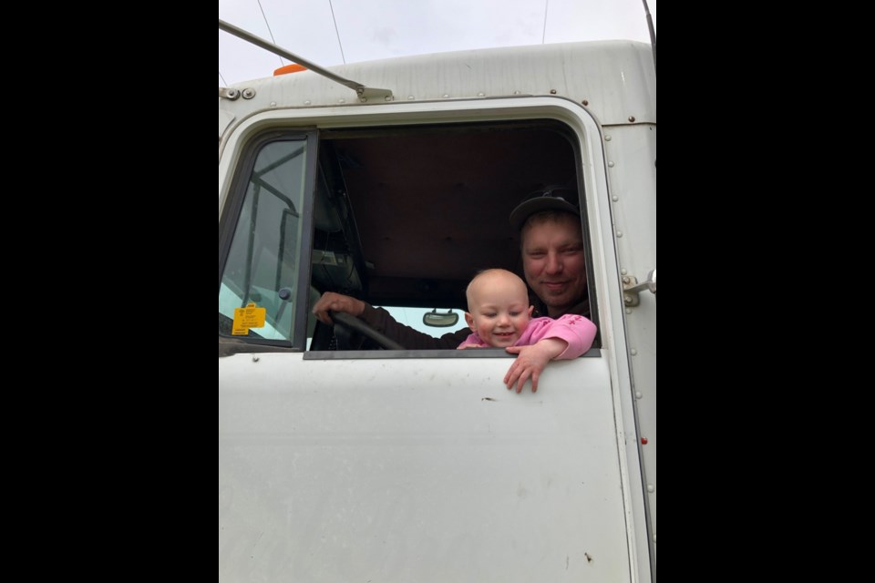 During a busy seeding day, Ava Mack had a quick visit with her dad, Dustin, in the tandem. Photo submitted