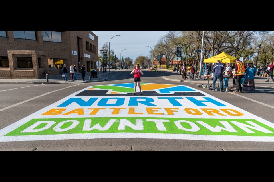 Two thumbs up for the new street painting at the corner of 13th and 101st which is in front of City Hall.