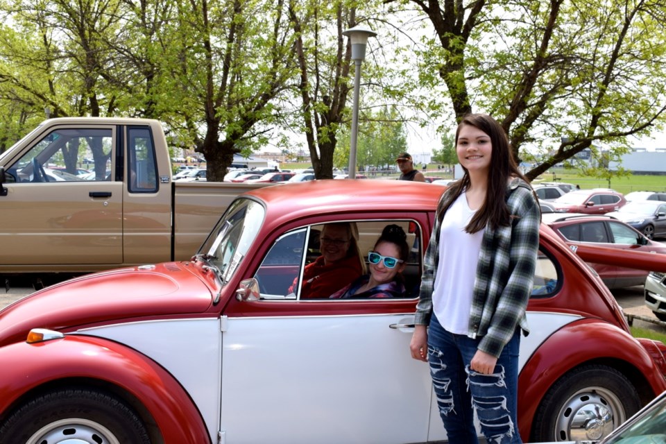 Katrina Zinchuk, Codie Lemcke and Madison Hrywkiw were checking out Lemcke's 1969 Volkswagen Beetle.