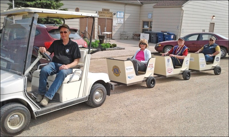 The Borden Lions wagon ride with Lions Ed, Jan, Bob and Perry trying it out. Ed gave rides to the kids at the sports grounds. Photos by Lorraine Olinyk