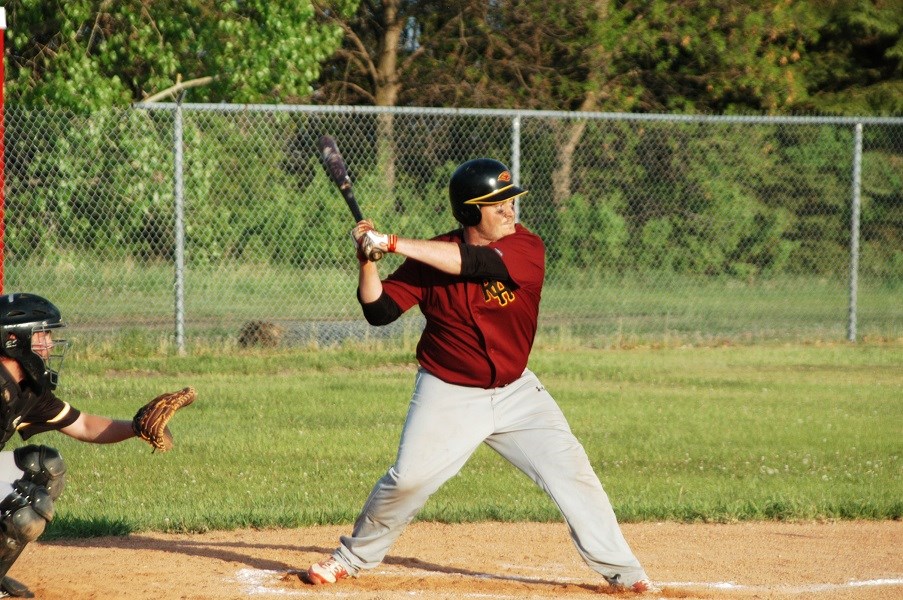 Austin Ballek at bat, ready to smash the ball through the air.