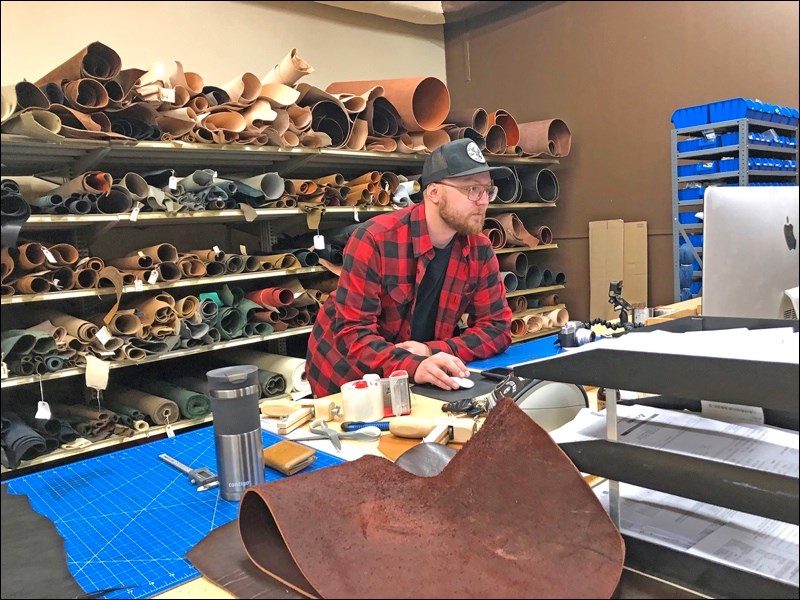 Ian Guenter at work in his leather wholesale business in Wilkie. Photo by Helen Urlacher