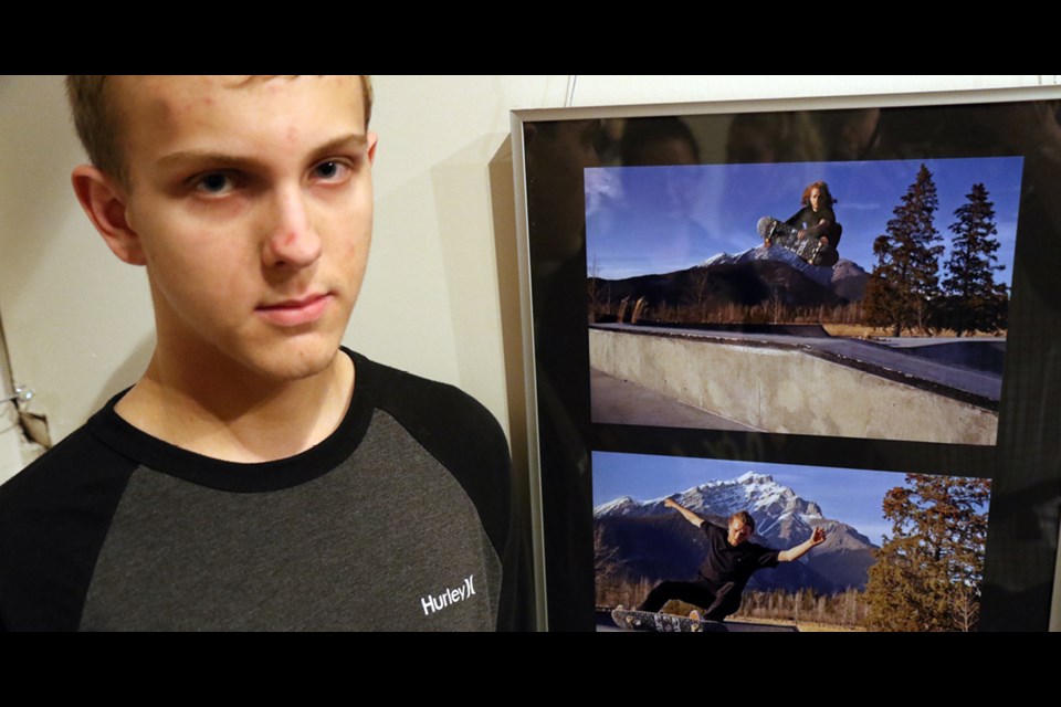 Mathew Maki, one of the eight Humboldt Collegiate students display photography at the Life Beyond the Lens exhibit at the Humboldt and District Museum, shows his favourite photos, ones of a skateboarder in Banff. Photo by Devan C. Tasa
