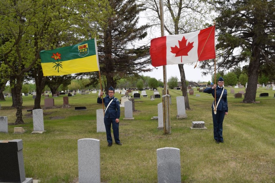 The Canora air cadets took part in the Decoration Day service at the Canora Cemetery on June 2 with the raising of the provincial and national flags by LAC Dawson Jennings, left, and Sgt. Tessa Spokes.
