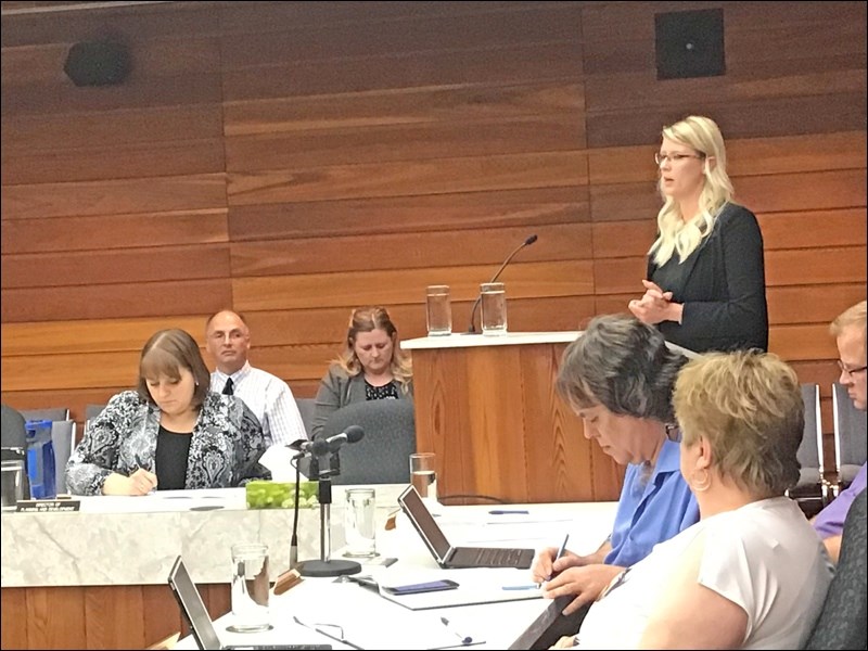 Chandra Reilly, regional manager for SAMA, is at the podium as a delegation from SAMA appeared befor