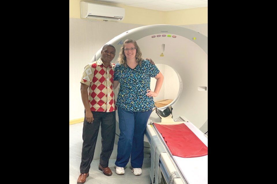 Tiana Palmer and a CT technologist at the hospital.