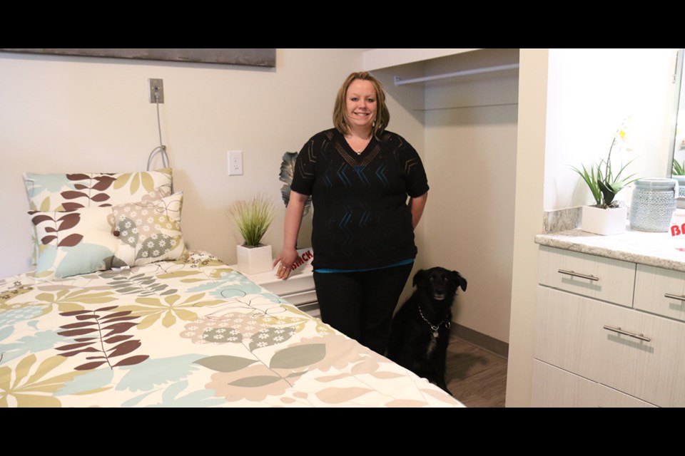 Leah Bornhorst, The Elizabeth’s director of personal care, shows off one of the 11 new 11 care rooms that are expected to open in July. Photo by Devan C. Tasa
