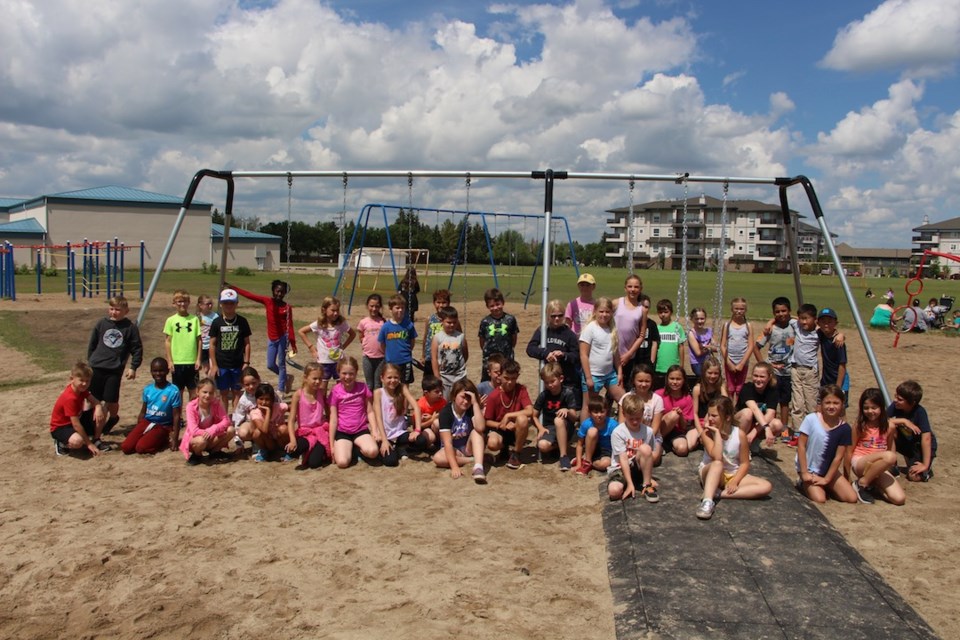 The students in Grade 3 at MC Knoll, whose work helped pay for the new swingset.