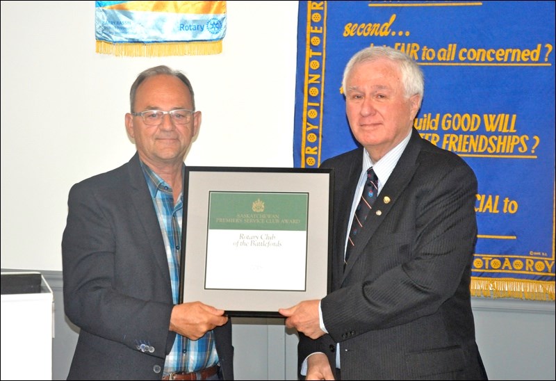 Monday was hardware night for the Rotary Club of the Battlefords. Outgoing president Wayne Ray (right) accepted the Premier’s Service Club Award on behalf of the organization from MLA Herb Cox. Photos by Josh Greschner