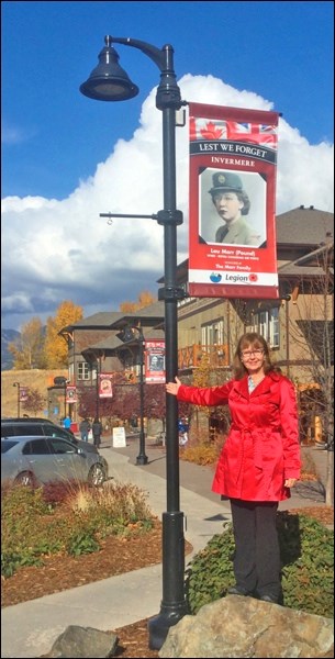 Elinor Florence with the banners honouring veterans of her home city, Invermere, B.C. The Fred Light