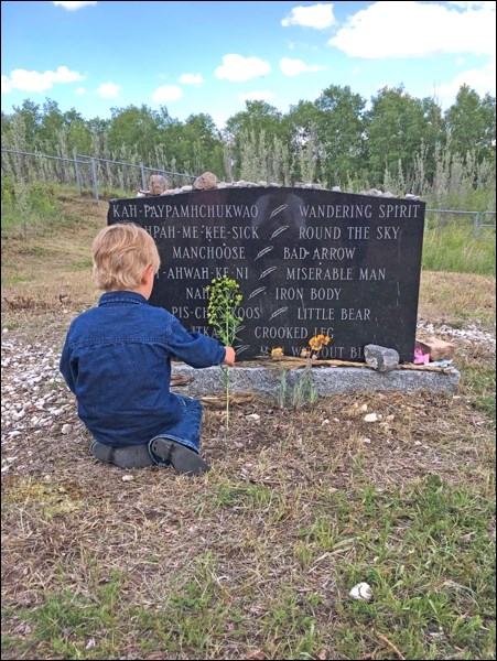 Gregory Rogers felt compelled to offer a flower in remembrance.