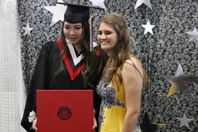 Vivian and friend at grad