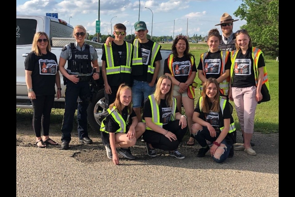The Canora Composite School SADD (Students Against Drinking and Driving) Chapter, with help from the Canora RCMP, recently conducted its final roadside check stop of the school year. From left, were: (standing) Shawna Leson (CCS SADD advisor), Cst. Kari Pettinger, Maxwell Mydonick, Jacob Danyluk, Kami Kuhn, Gracie Paul, Cst. Robert Gatenby and Larissa Makowsky, and (kneeling) Shayna Leson, Saryn Leson and Cassandra Danyluk.