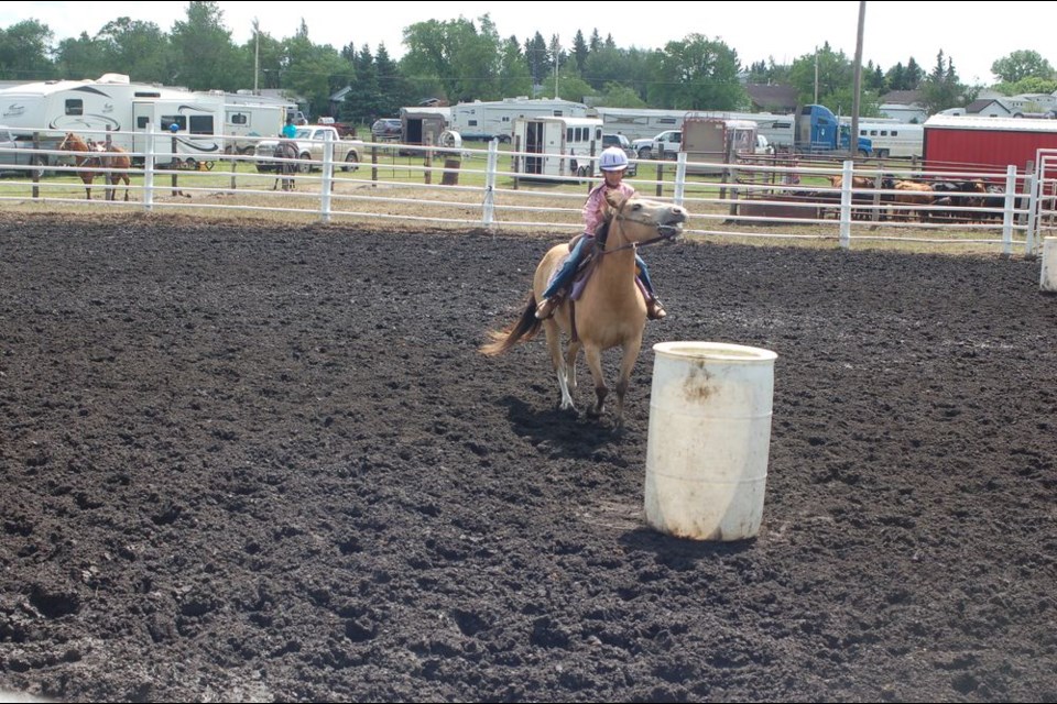 Emma Young steered her horse around a barrel during the Etomaimie Valley Riders gymkhana in Sturgis on June 23.