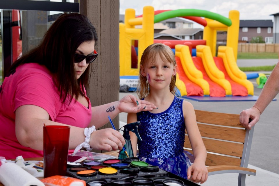 Tessa Widger, who is seven now, was celebrating her birthday along with Mr Mikes as Morgan Halladay was painting her face.